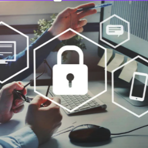 An image of a lock in the center with a computer behind it